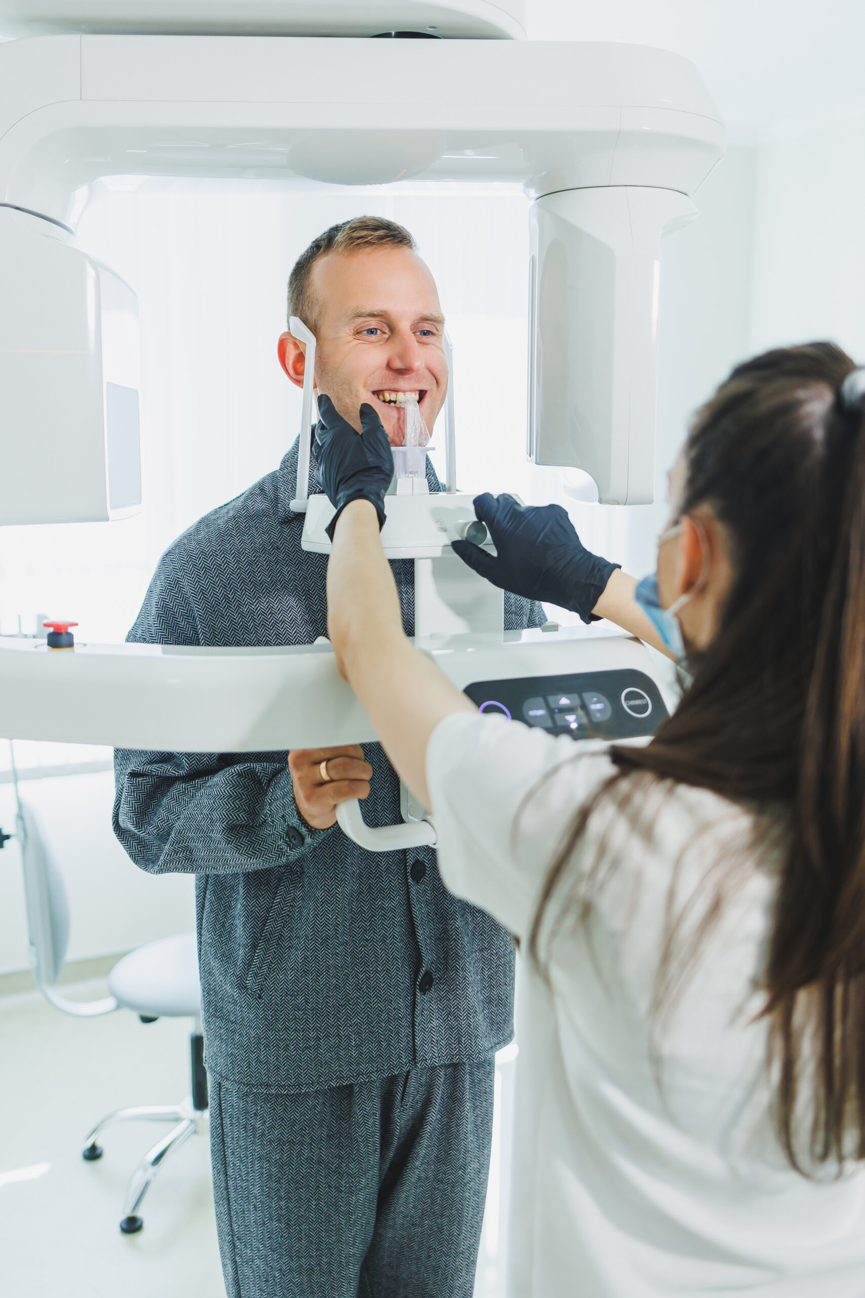 A young man underwent a CT scan of the jaw, a circular image of the jaw in modern dentistry. Radiology, panoramic scanner.