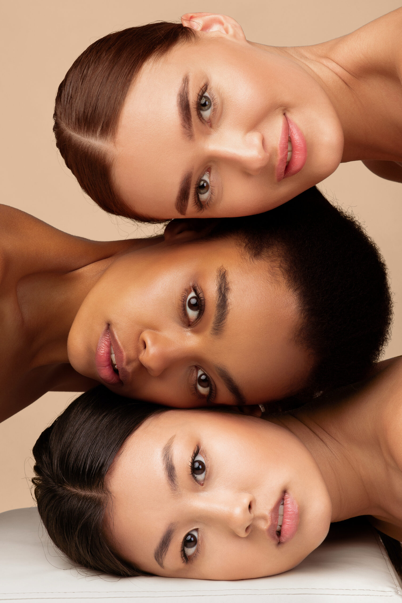 Multiracial Beauty. Portrait Of Multiethnic Asian, African American And Caucasian Women Looking At Camera Posing Over Gray Studio Background. Vertical
